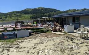 At Pukatewai Marae, Tolaga Bay, generations of whanau came together with mops and buckets to clean the silt and water from inside.