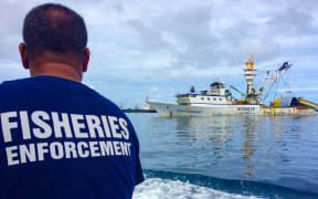 A fisheries officer in Majuro heads out to to inspect purse seine fishing vessels anchored in Majuro's lagoon.
