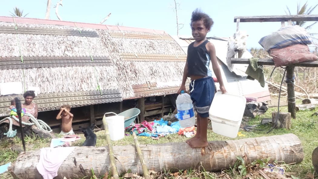 This little girl was sent by her mother to get some of the clean water being delivered for her baby sister.