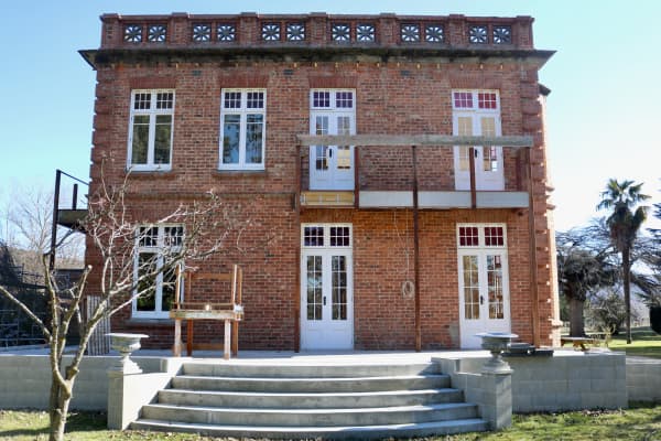 The lower floor of the eastern wing is being transformed into a ballroom, while the airy bedroom above boasts a walk-in wardrobe and en-suite with a freestanding bath.