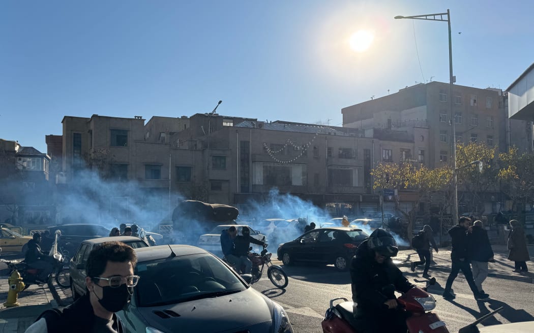 Shopkeepers and traders protest in the street against the economic conditions and Iran's embattled currency in Tehran on December 29, 2025. Some shopkeepers in Tehran closed their stores on December 29 in protest against economic hardships and sharp swings in Iran's embattled currency, Iranian media reported, following similar demonstrations a day earlier. Iran's currency has hit new lows on the unofficial market, with the US dollar trading at around 1.42 million rials on Sunday, compared to 820,000 rials a year ago and the euro nearing 1.7 million rials, according to price monitoring websites. (Photo by HANDOUT / FARS NEWS AGENCY / AFP)
