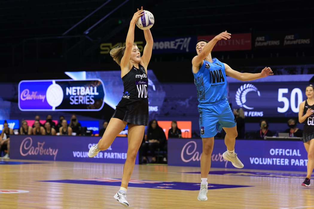 Silver Ferns Kate Heffernan (left) with Aotearoa Men Eriata Vercoe during the Cadbury Netball Series Silver Ferns v NZ Men game one at TSB Arena in Wellington on 10 October 2021.