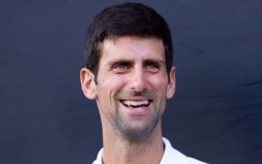 Novak Djokovic of Serbia smiles during a promotional photo call in Melbourne on January 9, 2019. (Photo by Asanka Brendon RATNAYAKE / AFP) / -- LY NO COMMERCIAL USE --