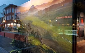 Iceland scene reflected in a shop window.