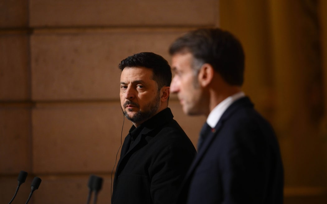 Ukraine's President Volodymyr Zelensky, left, and French President Emmanuel Macron stand next to one another at a press conference at the Elysee Palace in Paris, France, on December 1, 2025.