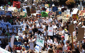 Students from different schools raise placards during a protest rally for climate change awareness at Martin Place in Sydney