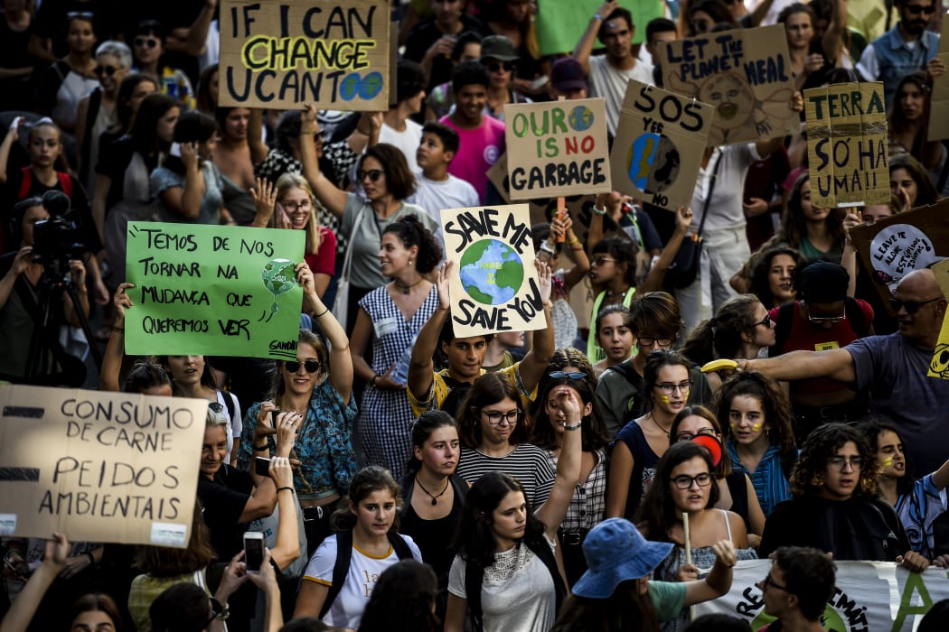 Demonstrators take part in a global youth climate action strike in Lisbon.