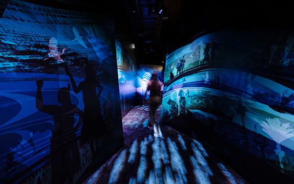 A person walks through a whare at Māwhera Pā.