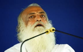 In this file photo taken on July 18, 2008 Indian spiritual leader Asaram Bapu addresses supporters at the sect's ashram (Spiritual Centre) on the outskirts of Ahmedabad.
