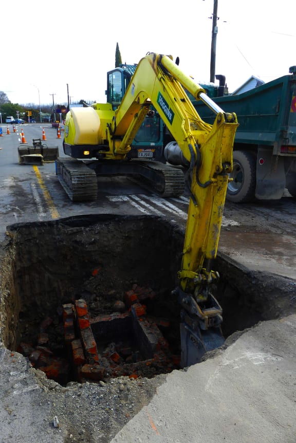 A digger at work at Renall St, Masterton.