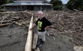 Steve Wheeler has silt up to two metres deep blanketing his Esk Valley property, plus thick slash which came down the Esk River and stopped at his lounge windows. Wheeler says his double-walled home, which he built himself, saved the lives of him and his family.
