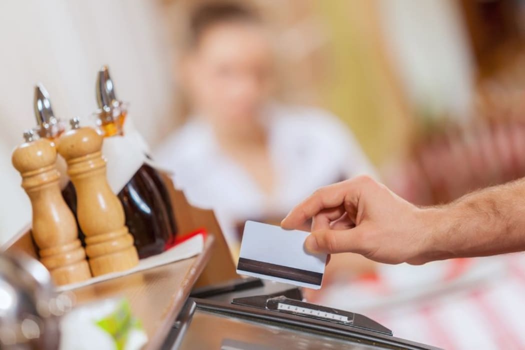 Credit card transaction in a restaurant.