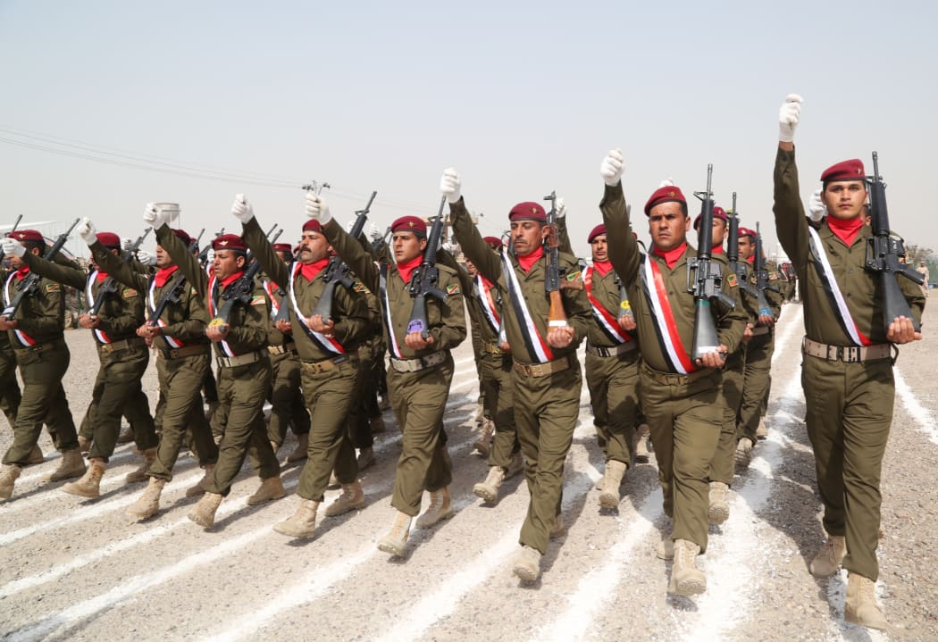 Iraqi Army soldiers march during the graduation ceremony of the Iraqi Army's Non- Commissioned Officers' Academy Junior Leaders Course at Taji Military Complex, Iraq.