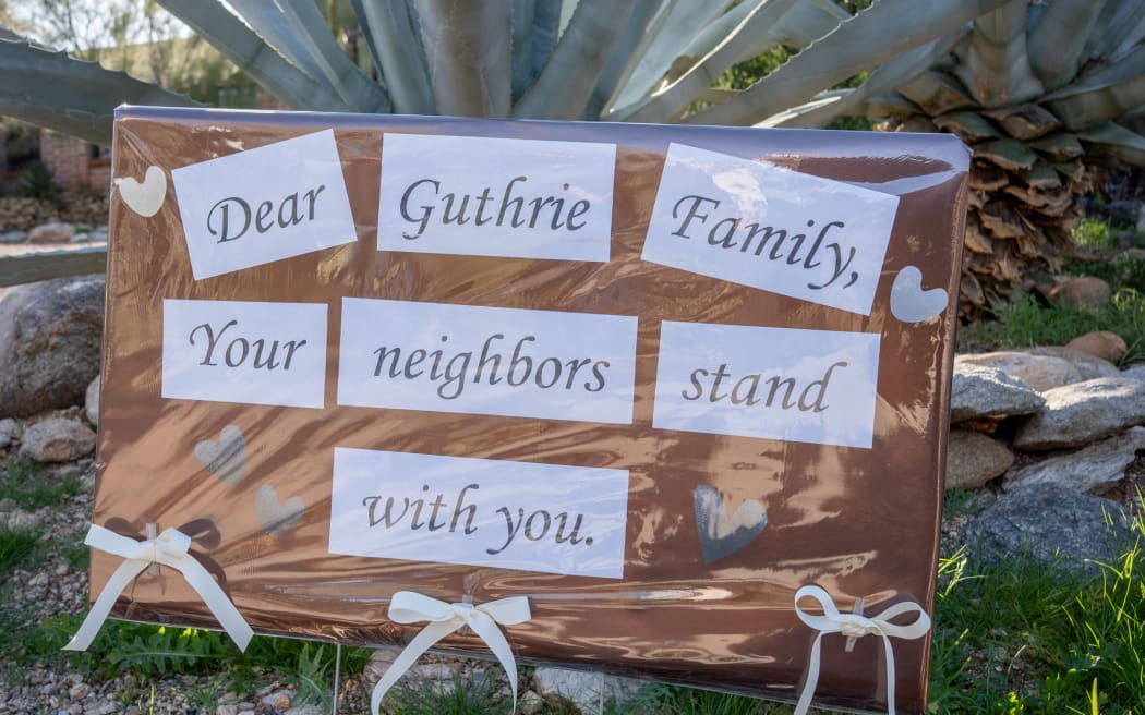 CATALINA, ARIZONA - FEBRUARY 3: A sign is posted at the house of Nancy Guthrie, NBC host Savannah Guthrie's mother, on February 3, 2026 in Catalina, Arizona.The search continues in the Tucson area for Nancy Guthrie, after she was reported missing on February 1.   Jan Sonnenmair/Getty Images/AFP (Photo by Jan Sonnenmair / GETTY IMAGES NORTH AMERICA / Getty Images via AFP)