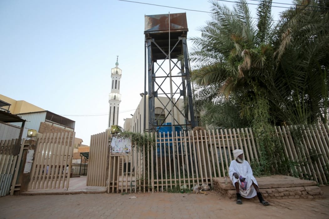 A Sudanese man outside a closed mosque in the capital Khartoum during the Muslim holy month of Ramadan amid a curfew due to the COVID-19 coronavirus pandemic.