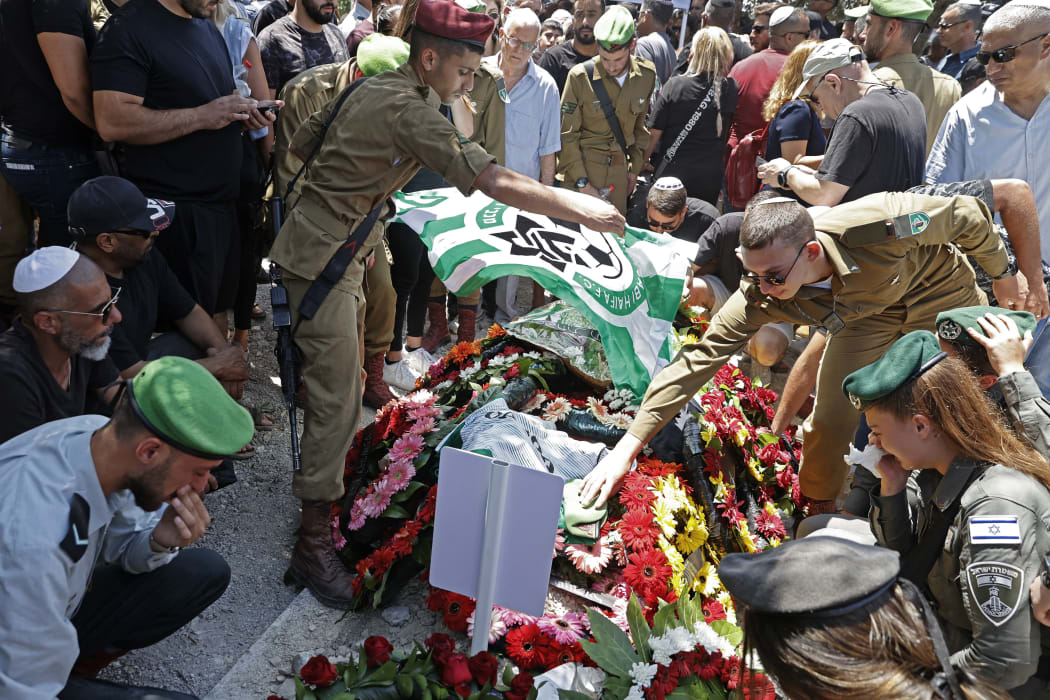 Israeli mourners attend the funeral of Israeli soldier Omer Tabib, 21, in Elyakim in northern Israel, 13 May 13, 2021. The army said Tabib was killed when Palestinian militants in Gaza fired an anti-tank missile near the border.