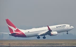 A Qantas Boeing 737-800 takes off from Sydney's Kingsford Smith airport in Sydney on November 1, 2019. (Photo by PETER PARKS / AFP)
