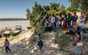 People fleeing fighting between Myanmar's military and rebels arrive at Sinkin village in Myanmar's northern Kachin State on 6 December, 2024.