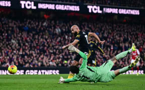 Manchester United's Bryan Mbeumo scores against Arsenal.