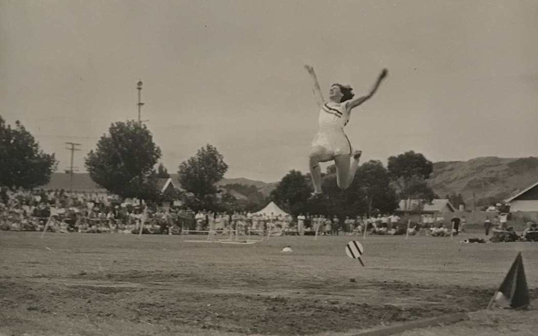 Yvette Corlett in mid-jump