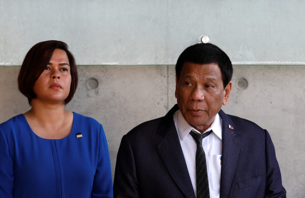 The President of the Philippines Rodrigo Duterte next to his daughter Sara (L) on September 3, 2018 during his visit to the Yad Vashem Holocaust Memorial museum in Jerusalem