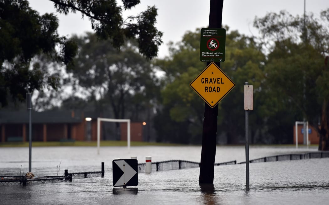Floodwaters submerge a road after the Georges River burst its banks in Sydney.