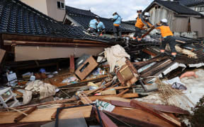 Fire-fighters conduct a search for survivors of the New Year's Day 2024 earthquake in Suzu City, Ishikawa Prefecture on 4 January, 2024.
