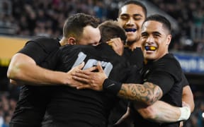 The All Blacks celebrate Beauden Barrett's 2nd try.