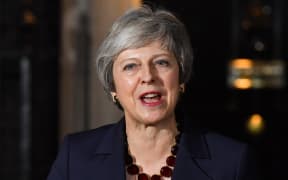 The British prime minister, Theresa May says her Cabinet has agreed the government should accept a draft treaty on Britain's departure from the European Union.
