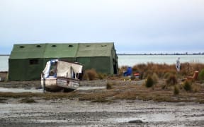 Nelson police at the scene where the body of a man was found on board a boat.