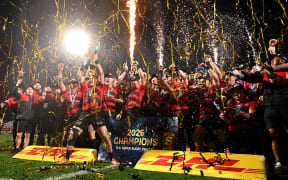 David Havili of the Crusaders and teammates celebrate with the Super Rugby Pacific trophy.