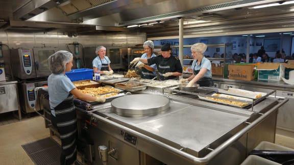 Students and Navy staff prepared the fish and chips for the 400 guests.