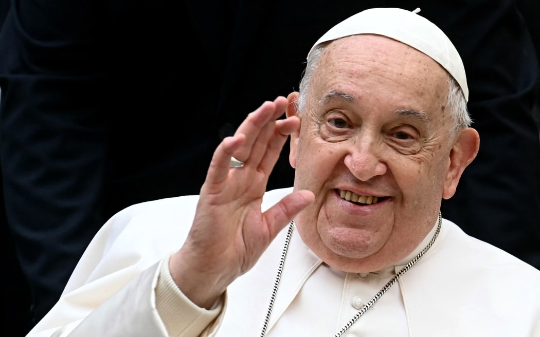 Pope Francis pictured waving in December, 2024.