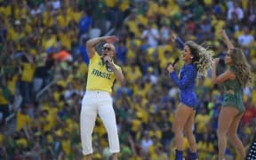 US rapper Pitbull, Brazilian singer Claudia Leitte and US singer Jennifer Lopez perform during the opening ceremony of the 2014 FIFA World Cup.