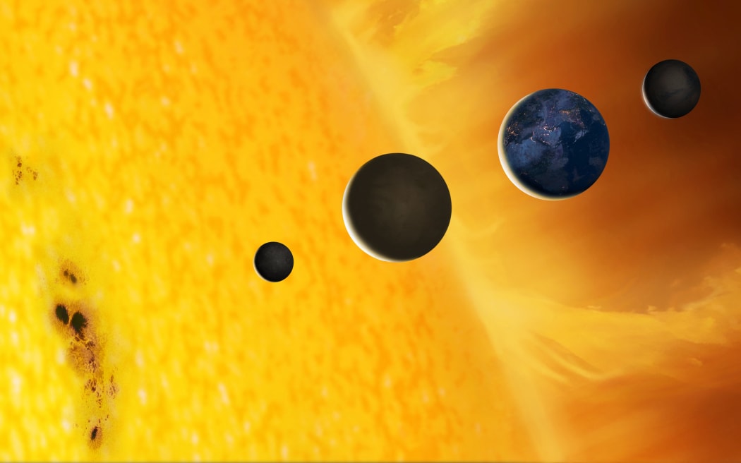 Schematic illustration showing the surface of the Sun and the terrestrial planets on the same scale. The Sun's surface, or photosphere, is not smooth, but rather has a granulated appearance - the grains mark the boundaries of rising cells of gas, carrying heat to the surface by convection. Sunspots are also a prominent feature of the photosphere - they can be as big as the Earth. From left to right, in order of increasing distance from the Sun, are the inner planets Mercury, Venus, Earth and Mars. They are to scale relative to each other and to the Sun, but their distances from each other and the Sun are not to scale (Photo by MARK GARLICK/SCIENCE PHOTO LIBRA / MGA / Science Photo Library via AFP)