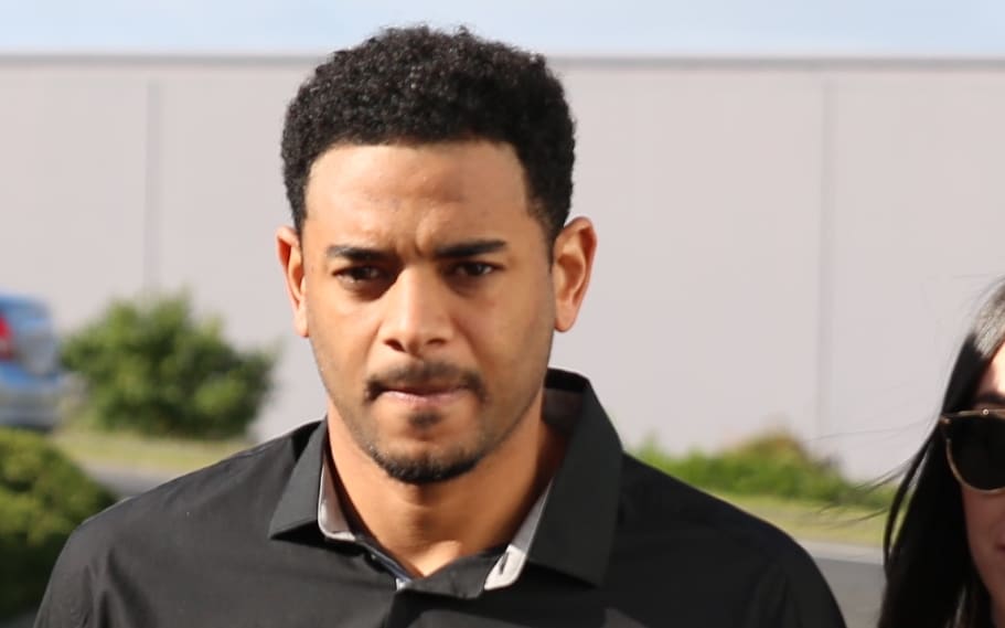 Corey Webster enters the North Shore Distric Court.