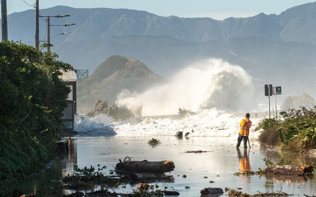 Swell hits a section of coastal road in Wellington.