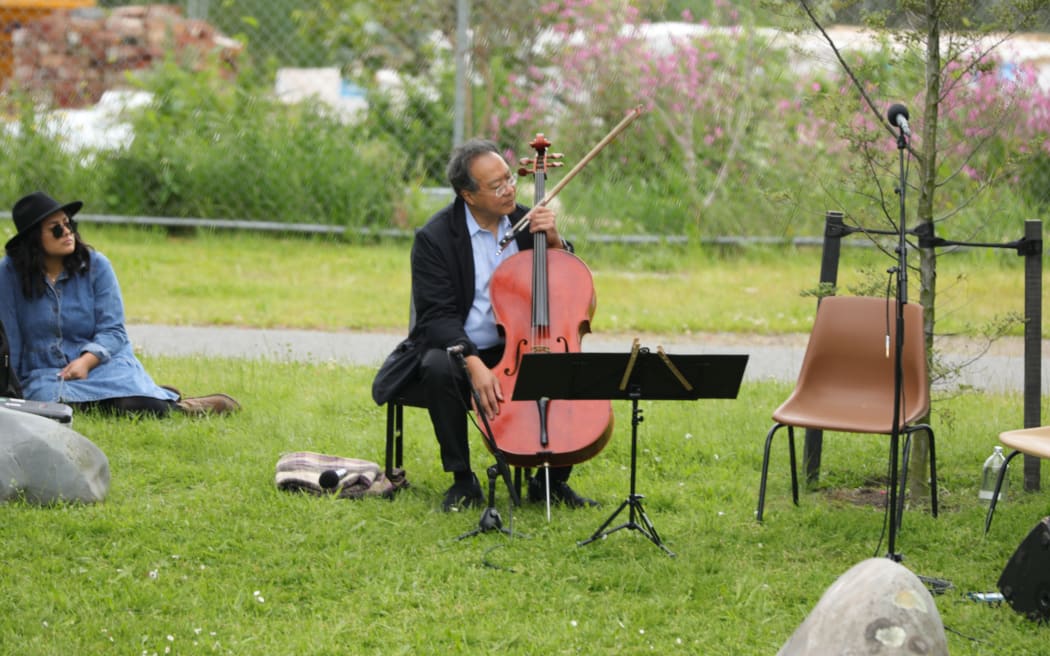 Yo Yo Ma performs a concert on the banks of the Avon river for Christchurch locals