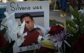 FRANKLIN PARK, ILLINOIS - SEPTEMBER 15: A picture of Silverio Villegas Gonzalez is seen at a memorial located along the street near where he was shot and killed by an Immigration and Customs Enforcement (ICE) agent on September 15, 2025 in Franklin Park, Illinois. Villegas Gonzalez, a single father of two young children, was shot and killed by ICE agents after trying to drive away from a traffic stop on September 12.   Scott Olson/Getty Images/AFP (Photo by SCOTT OLSON / GETTY IMAGES NORTH AMERICA / Getty Images via AFP)