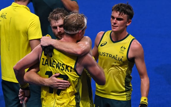Players of Australia celebrate after defeating Germany 3-1 in their men's semi-final match of the Tokyo 2020 Olympic Games field hockey competition, at the Oi Hockey Stadium in Tokyo, on August 3, 2021.