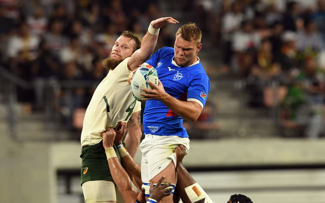 Players of South Africa and Namibia battle for the ball in a line-out.