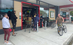 Queues for community supermarkets and petrol stations in Gisborne extended down the street on Wednesday afternoon.