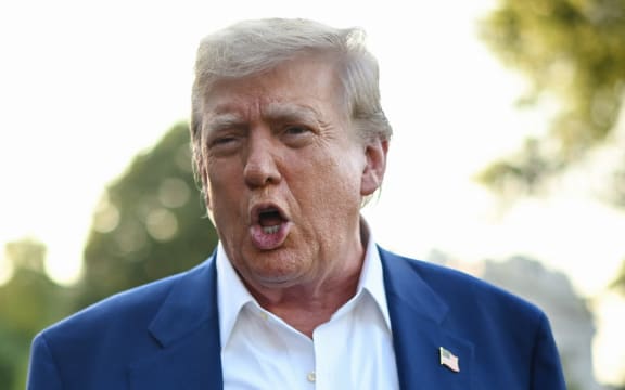 US President Donald Trump speaks to the press before boarding Marine One from the South Lawn of the White House in Washington, DC on 24 June, 2025, to attend the NATO's Heads of State and Government summit in The Hague.
