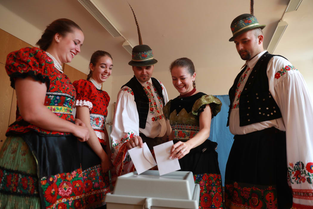 Voters wearing traditional Matyo costume cast  ballots in Mezokoevesd, eastern Hungary.