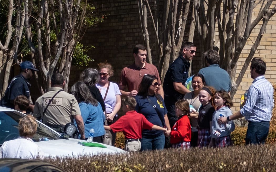 NASHVILLE, TN - MARCH 27: Children arrive at Woodmont Baptist Church to be reunited with their families after a mass shooting at The Covenant School on March 27, 2023 in Nashville, Tennessee. According to initial reports, three students and three adults were killed by the shooter, a 28-year-old woman. The shooter was killed by police responding to the scene.   Seth Herald/Getty Images/AFP (Photo by Seth Herald / GETTY IMAGES NORTH AMERICA / Getty Images via AFP)