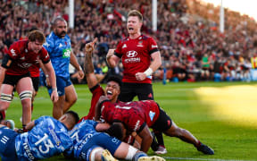 Leicester Faingaanuku (on ground) and Mitchell Drummond of the Crusaders celebrates Codie Taylor of the Crusaders try during the Super Rugby Aotearoa rugby match, Crusaders V Blues