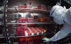 A lab technician testing potential vaccines at a lab in France. The company, Sanofi, is testing to find a vaccine for Covid-19.