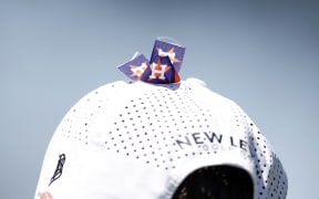 A view of the Houston Astros logos on the hat of Steven Alker in honor of his caddie Sam Workman who died earlier in 2023.