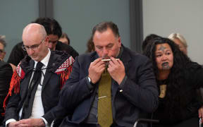 Kiwa Hammond plays the kōauau (Māori flute) at the ceremony