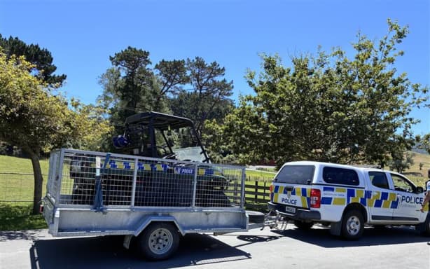 Police vehicle and trailer arrive at chopper scene near Wellington